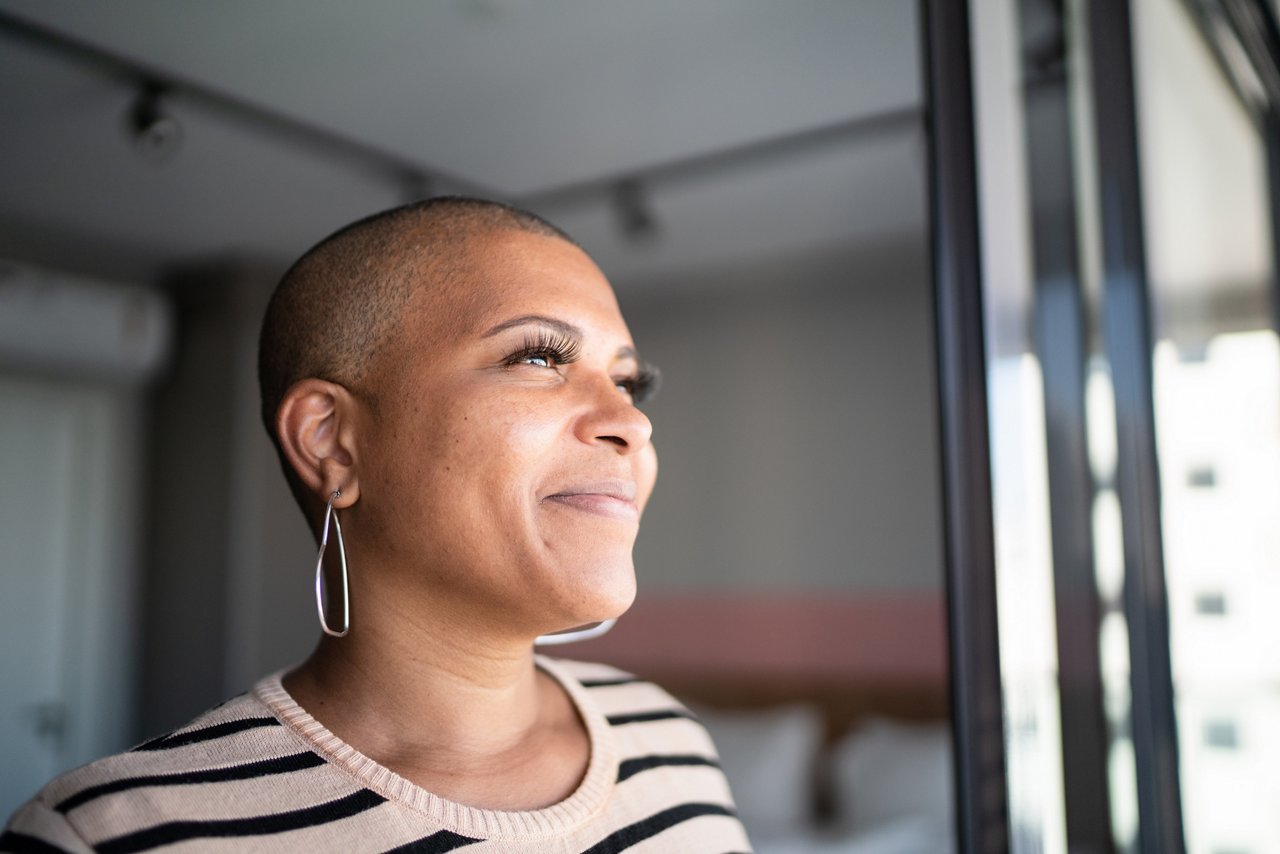Mature woman contemplating at home