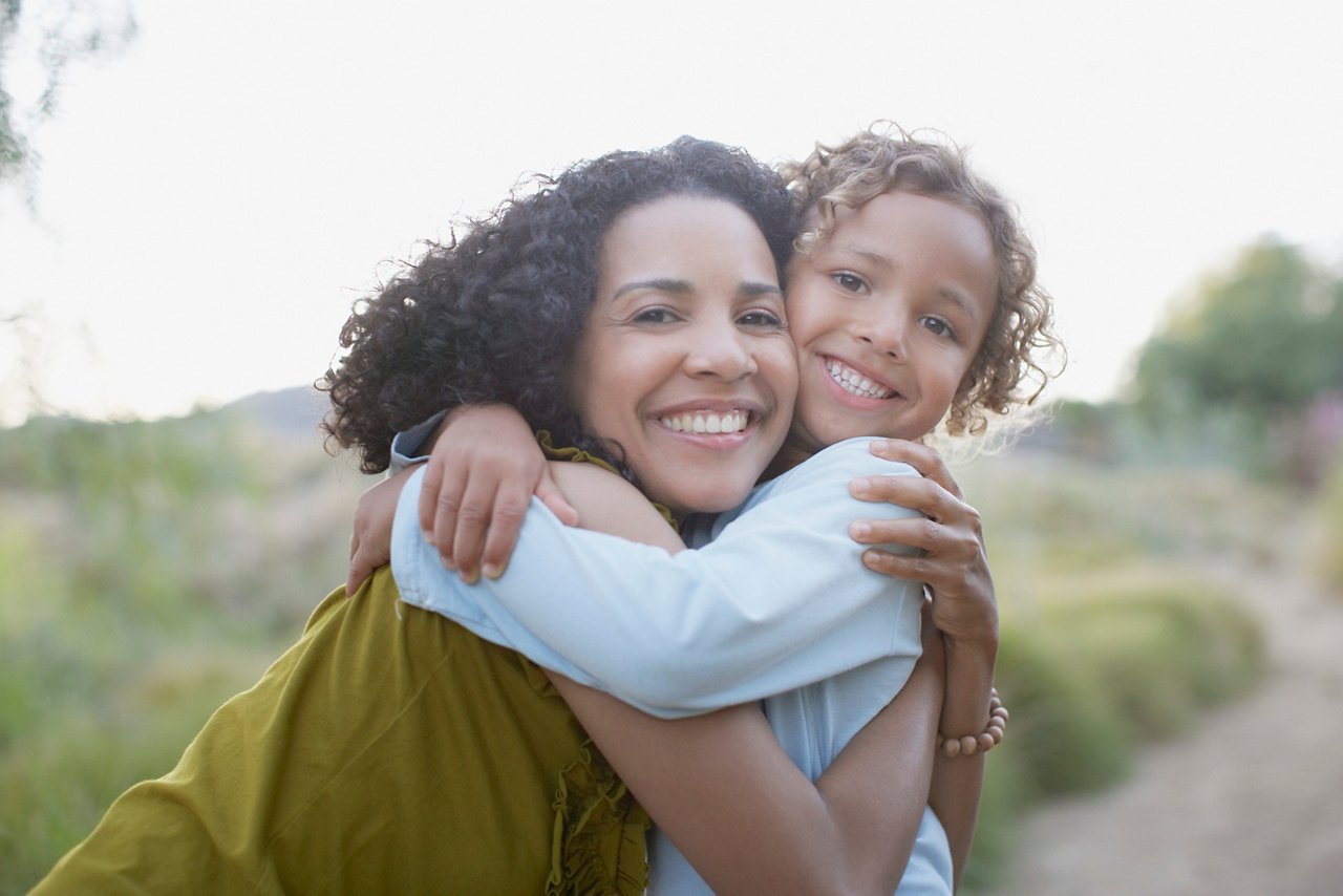 Mother and Son Hugging Outdoors